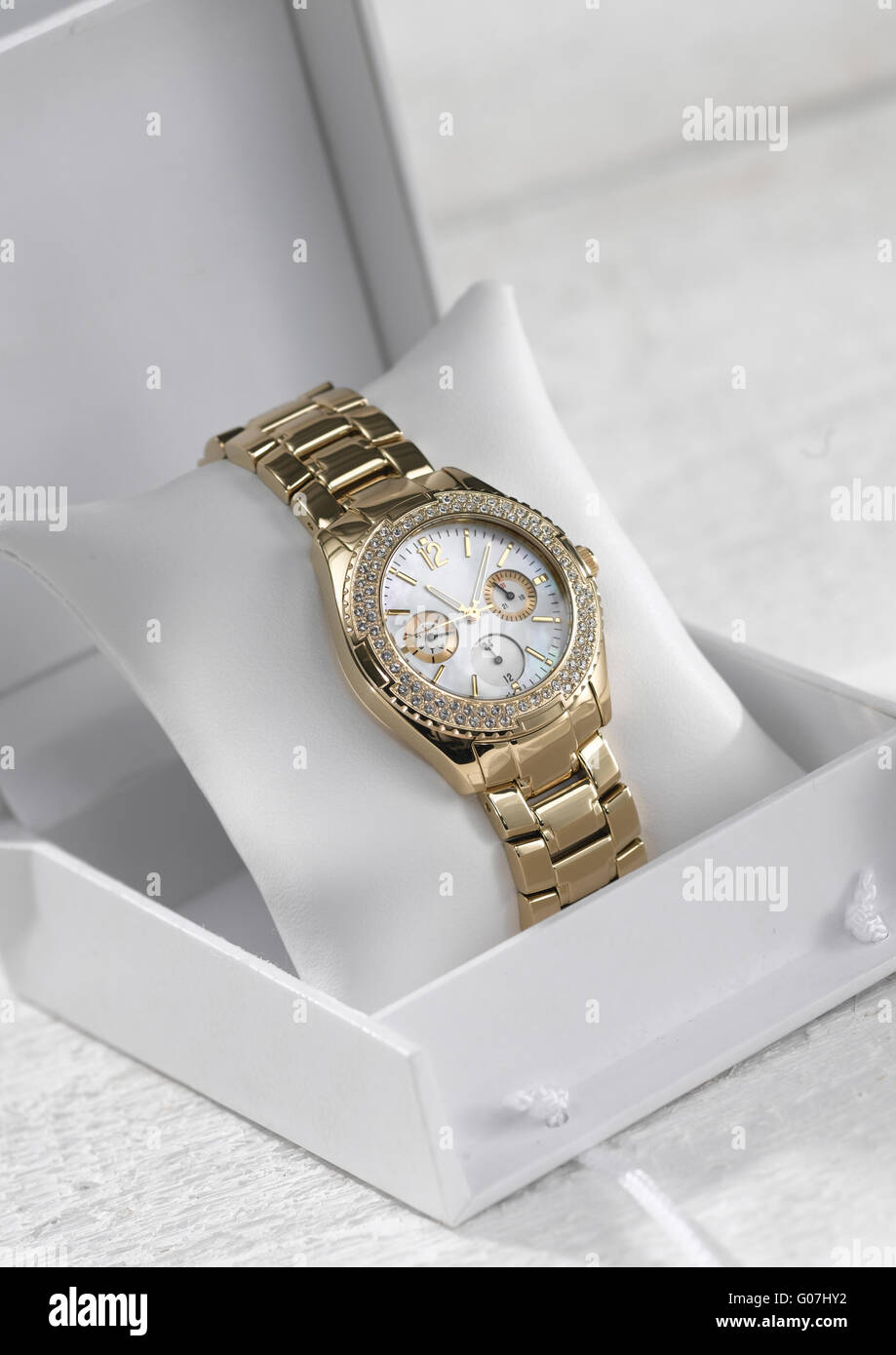 Gold Lady watch in white box Stock Photo