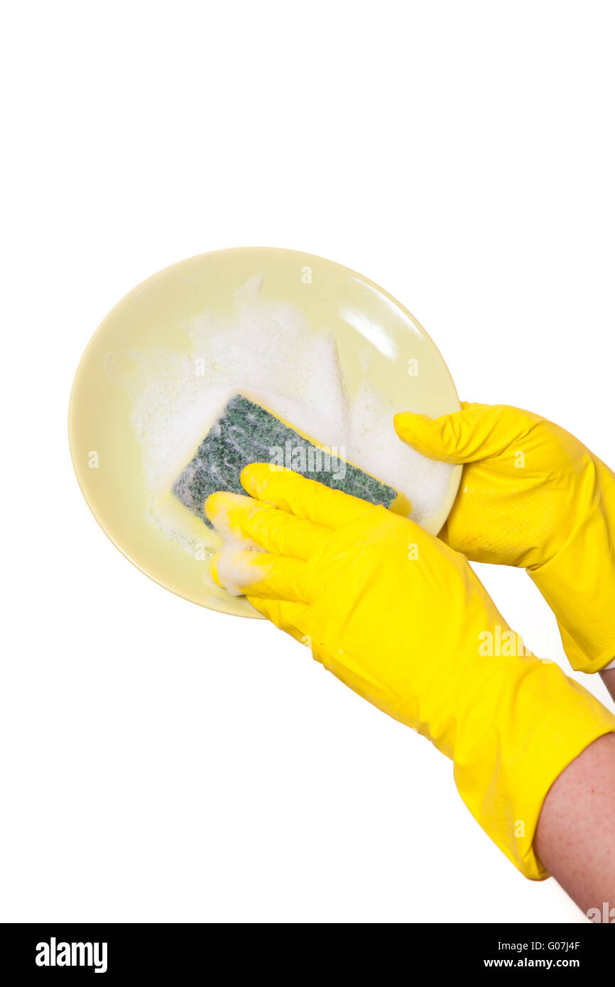hands in rubber yellow gloves washing dirty plate Stock Photo - Alamy