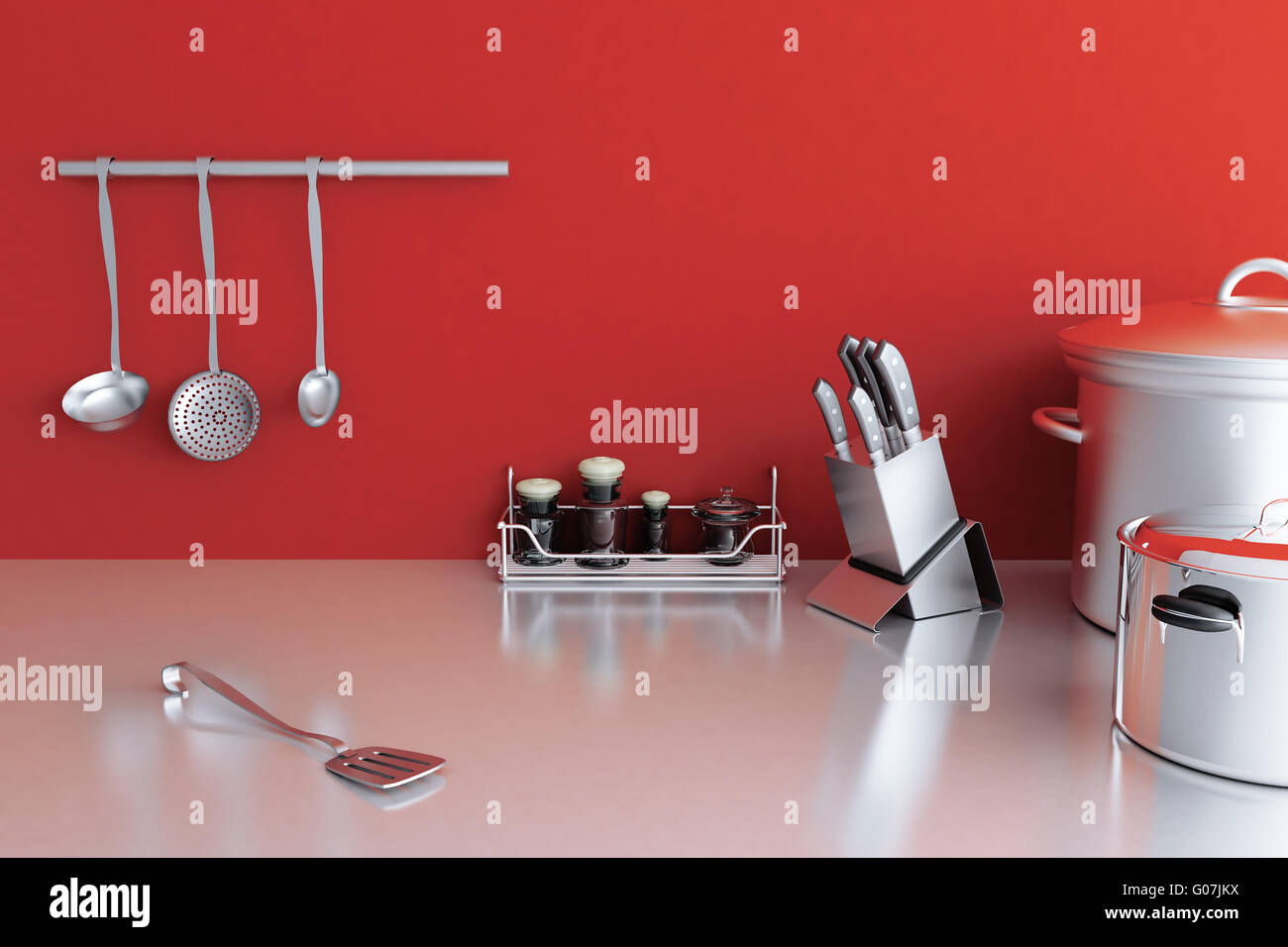 metallic kitchenware on a background of red wall Stock Photo - Alamy