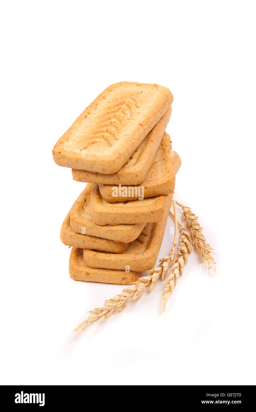 pile of pastry cookies with wheat isolated on whit Stock Photo