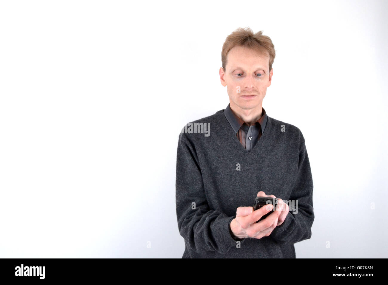 Blond man with mobile phone Stock Photo