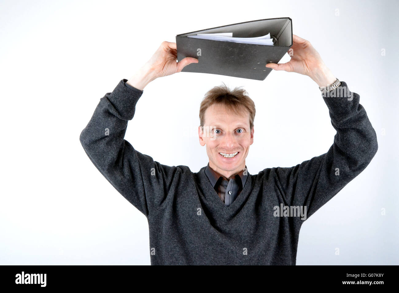 Blond man with a file folder on the head Stock Photo