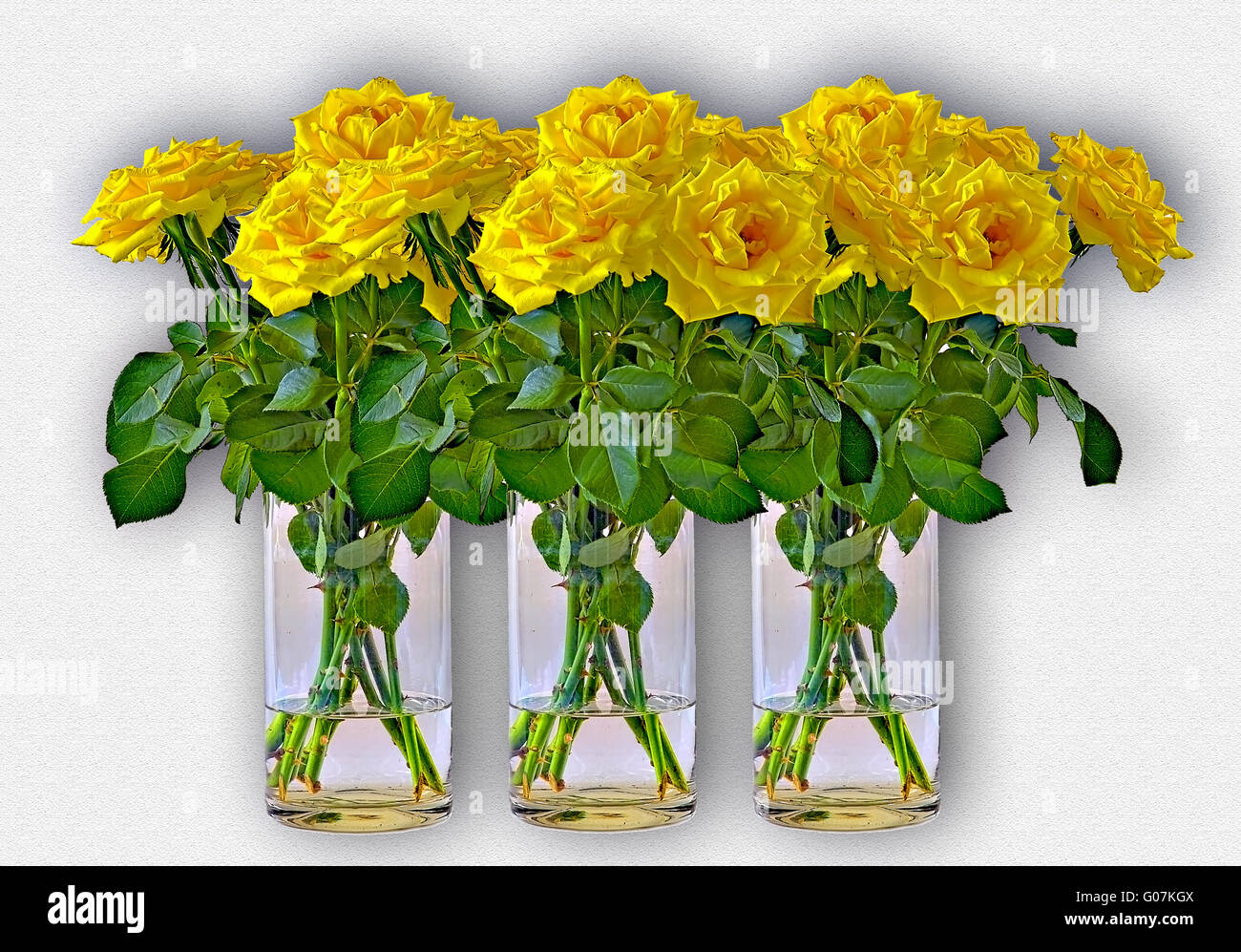 Three bunches of yellow roses in vases of glass Stock Photo
