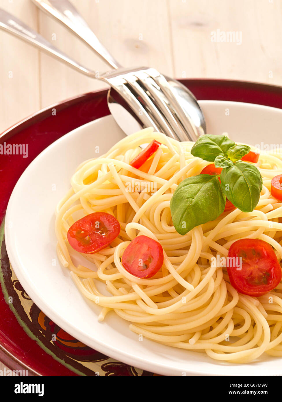 Spaghetti with cocktail tomatoes and fresh basil Stock Photo Alamy