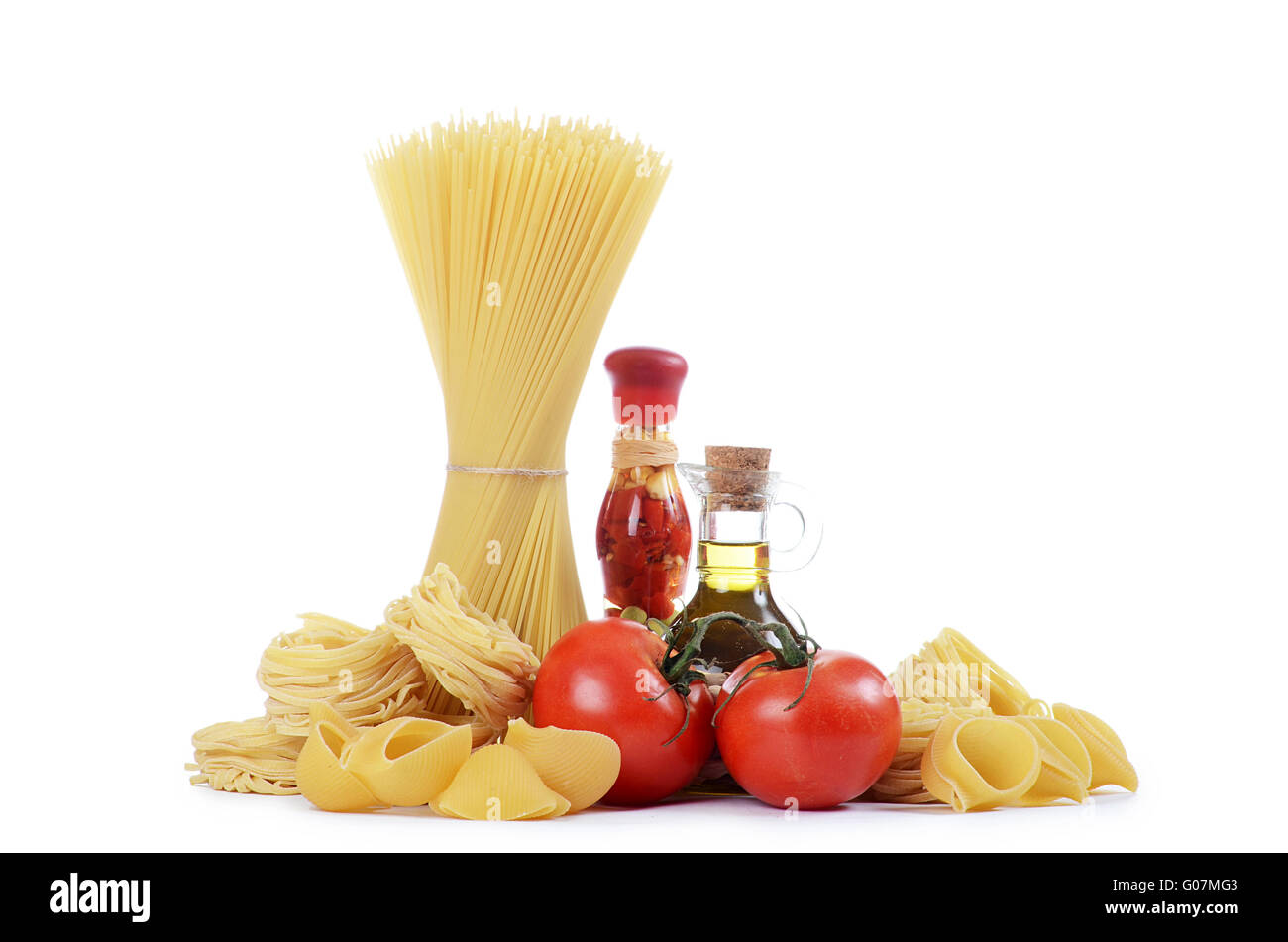 A plate of spaghetti tossed in olive oil with fresh diced tomatoes and herbs