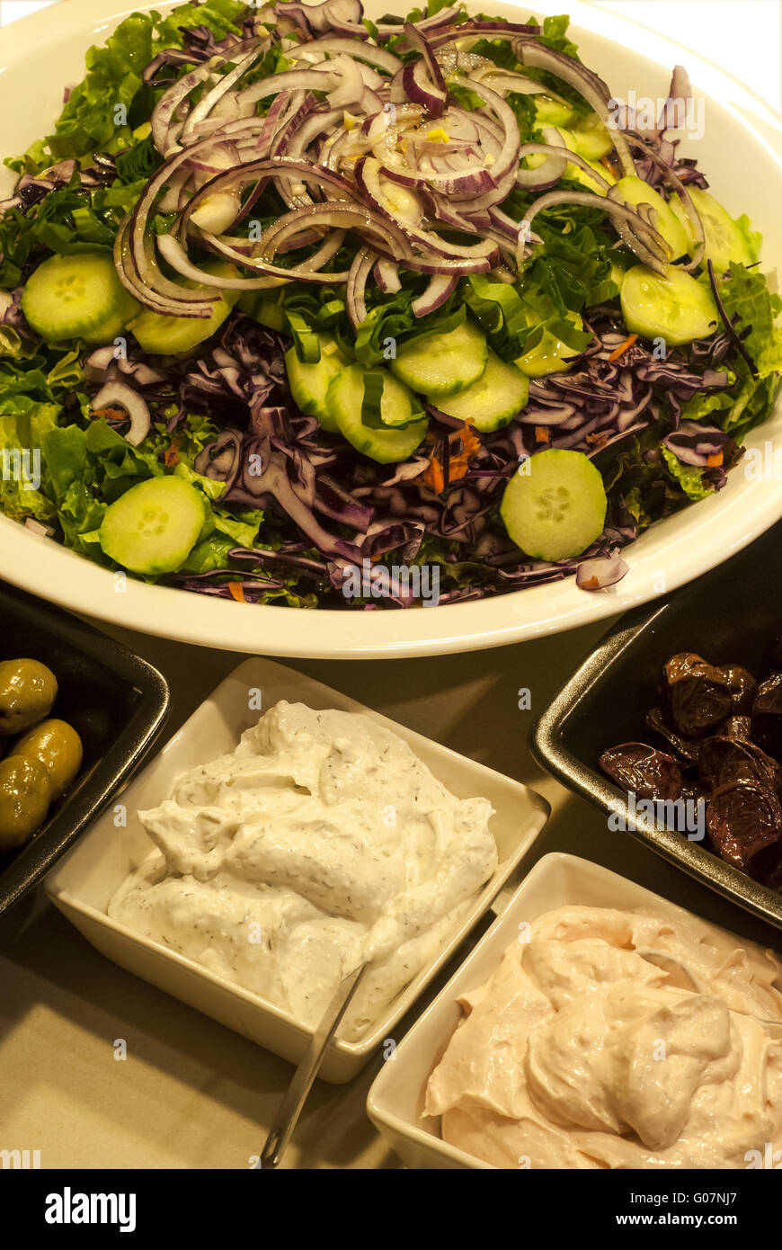 Mixed salad dish, olives, caviar roe spread Stock Photo Alamy