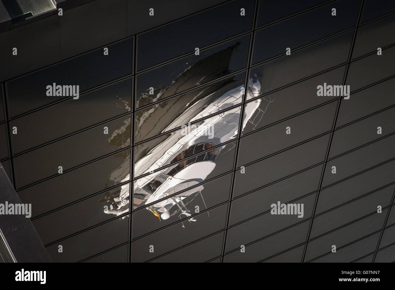 Reflection of a white motor yacht in the black fac Stock Photo - Alamy