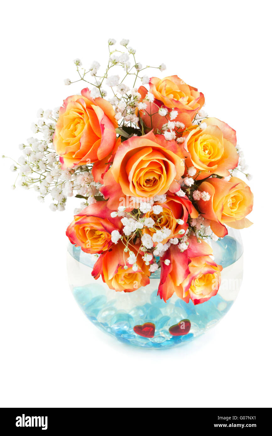 Beautiful bouquet of roses in a glass round vase Stock Photo