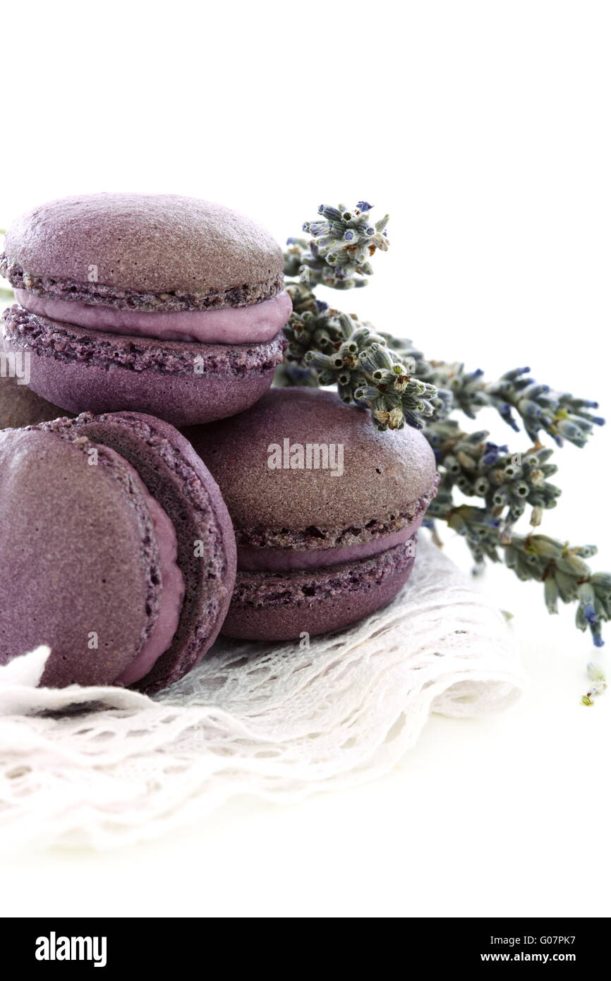 Macaroons with lavender and cream with black currant. Stock Photo