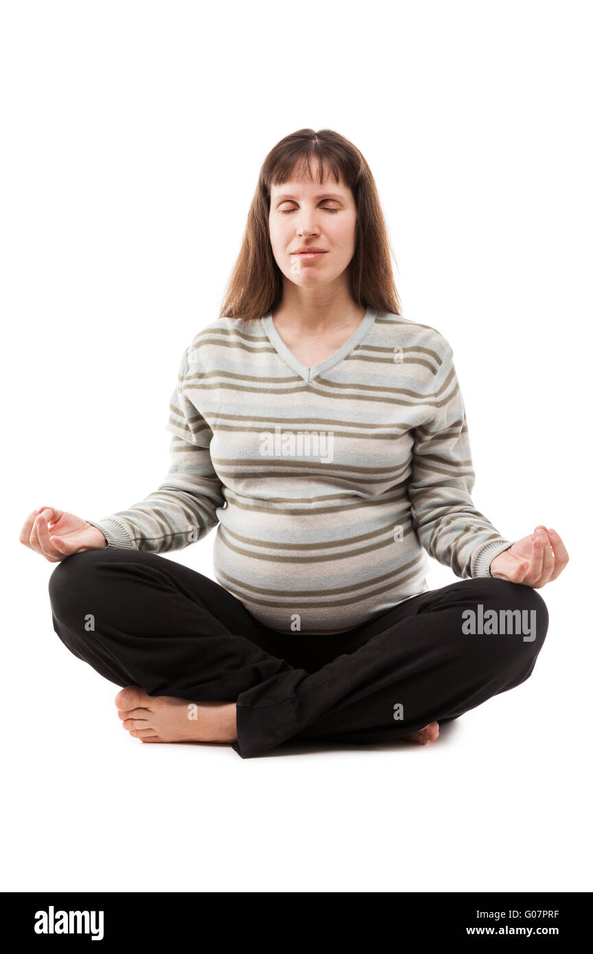 Beauty pregnant woman meditating in yoga exercise Stock Photo