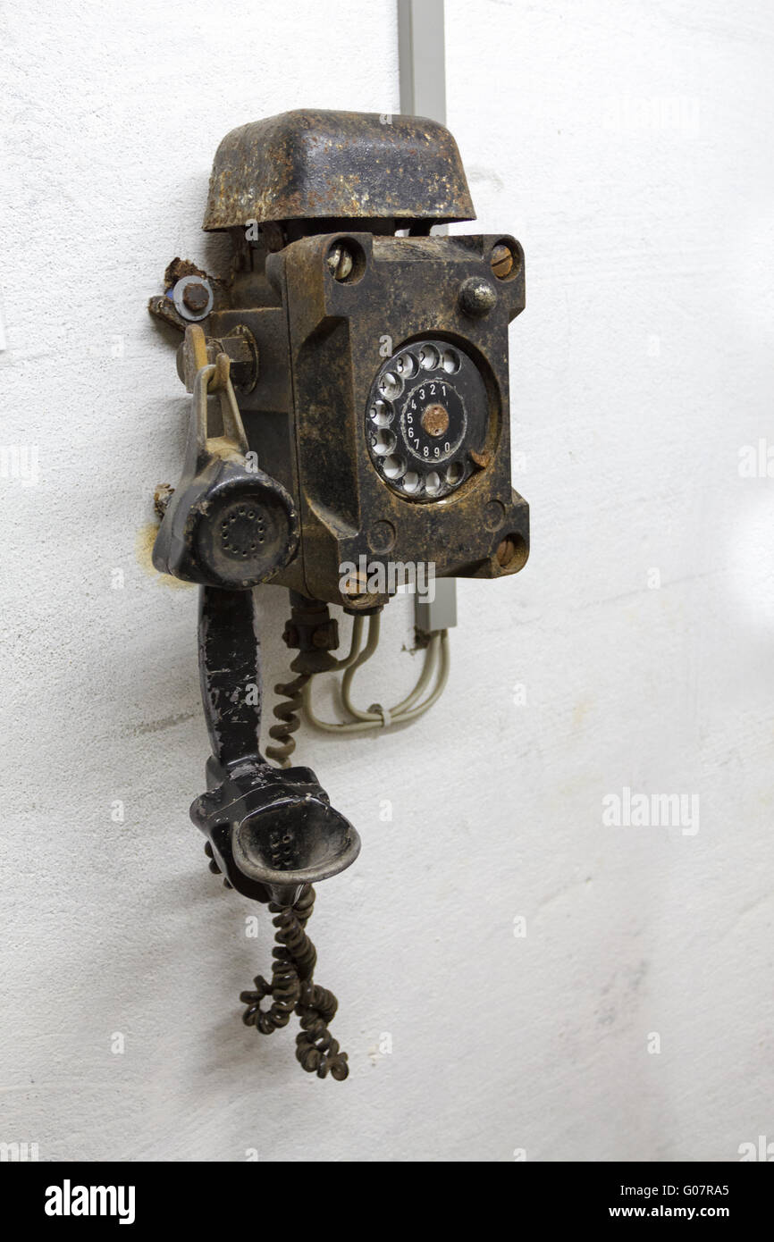 Old phone in bunker in Germany in the underground Stock Photo