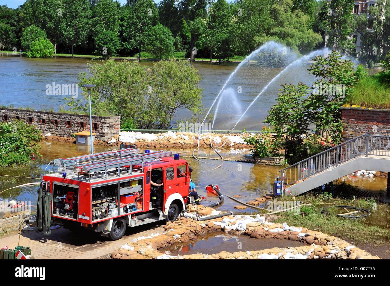 Firefighters in action during high water in Magdeb Stock Photo