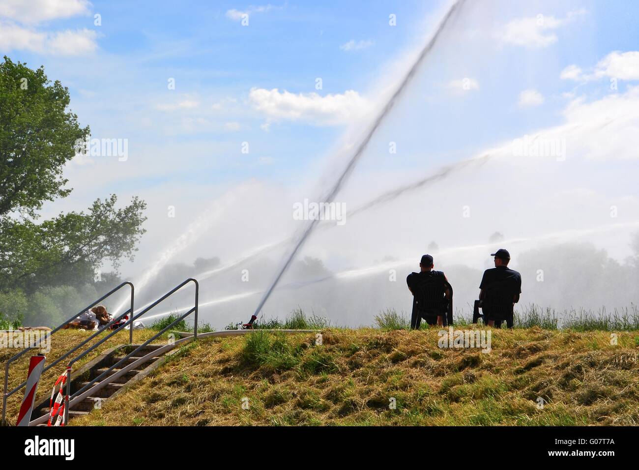 pumping of water back into the river during floods Stock Photo