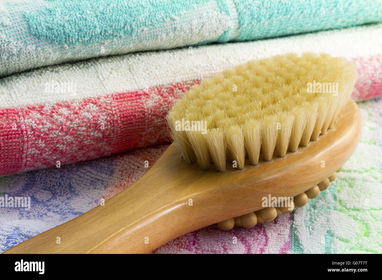 Wooden brush with the handle for massage of a body Stock Photo
