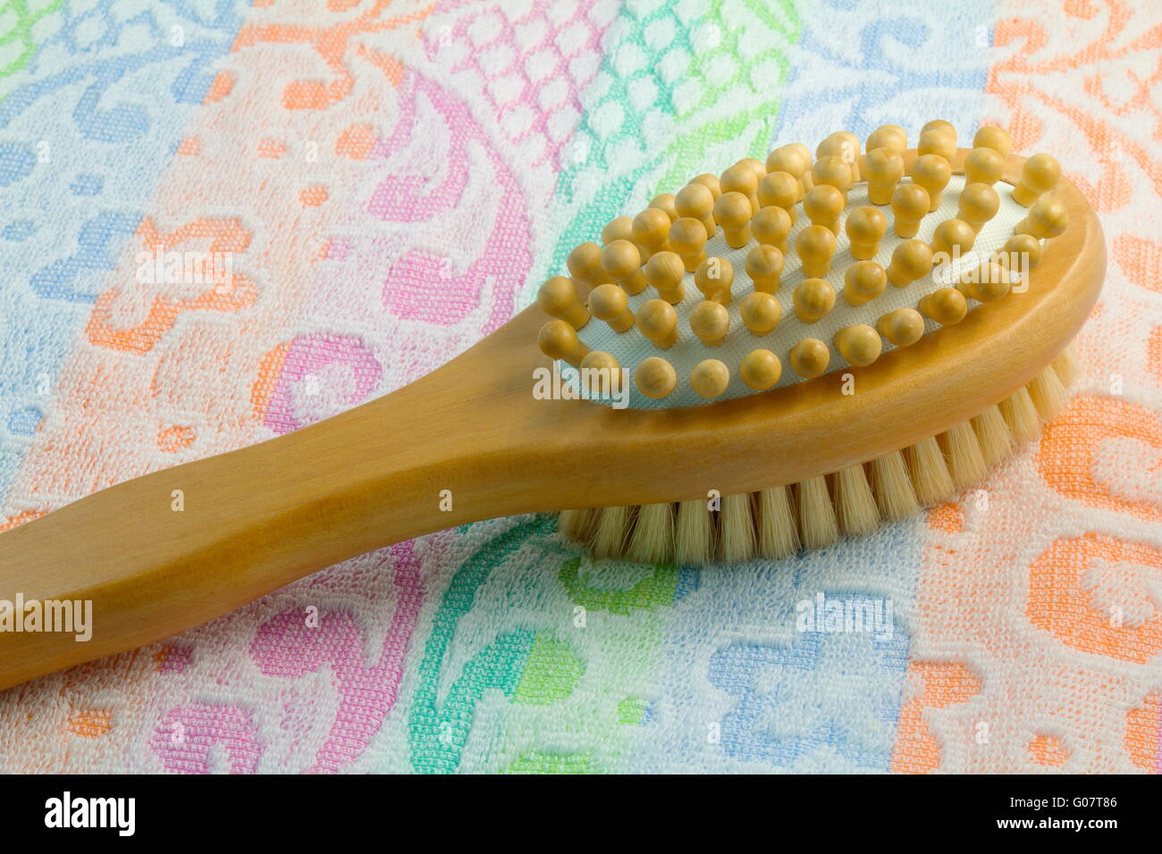 Wooden brush with the handle for massage of a body Stock Photo