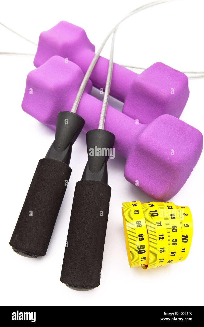 Skipping rope, measuring tape and and Pink dumbbel Stock Photo