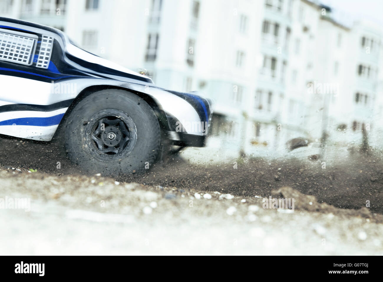 rapidly whirling wheel of a radiocontrolled cars Stock Photo Alamy