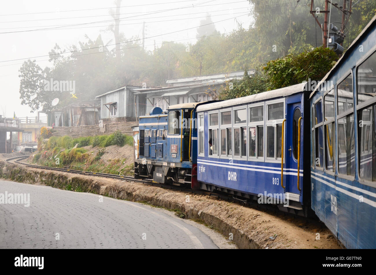 Darjeeling Himalayan Railway, Toy Train climbing a steep slope on a curve. Stock Photo