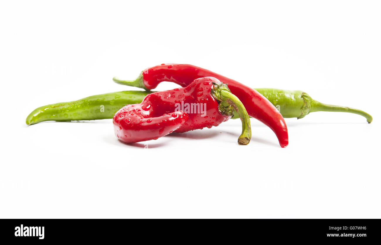 Juicy red and green chili peppers isolated on white Stock Photo - Alamy