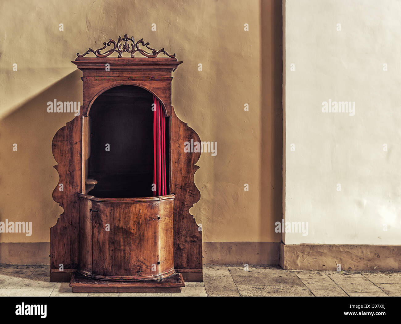 Old wooden confessional in Italy Stock Photo