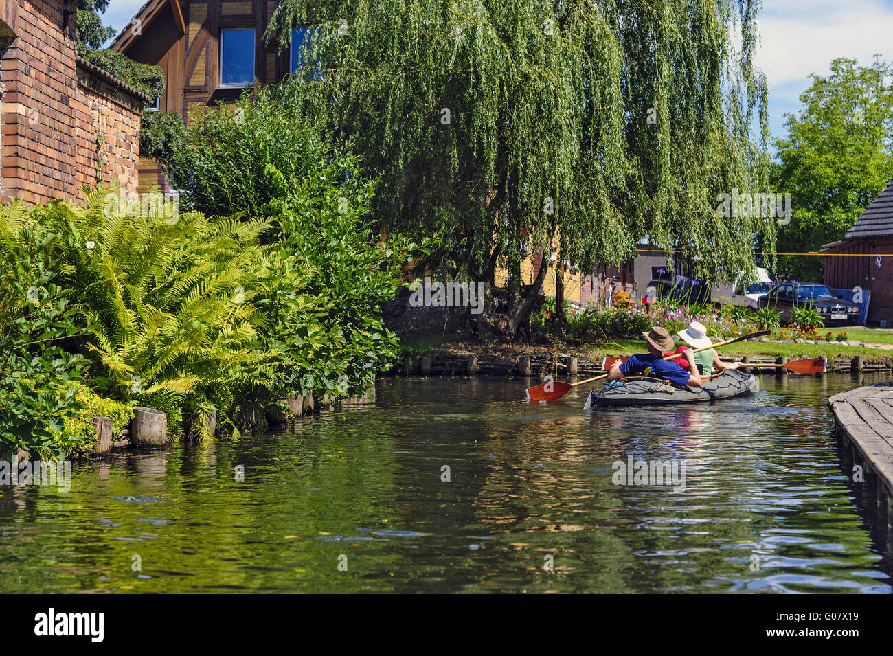 Paddle boat with 2 people in the Spreewald village Stock Photo