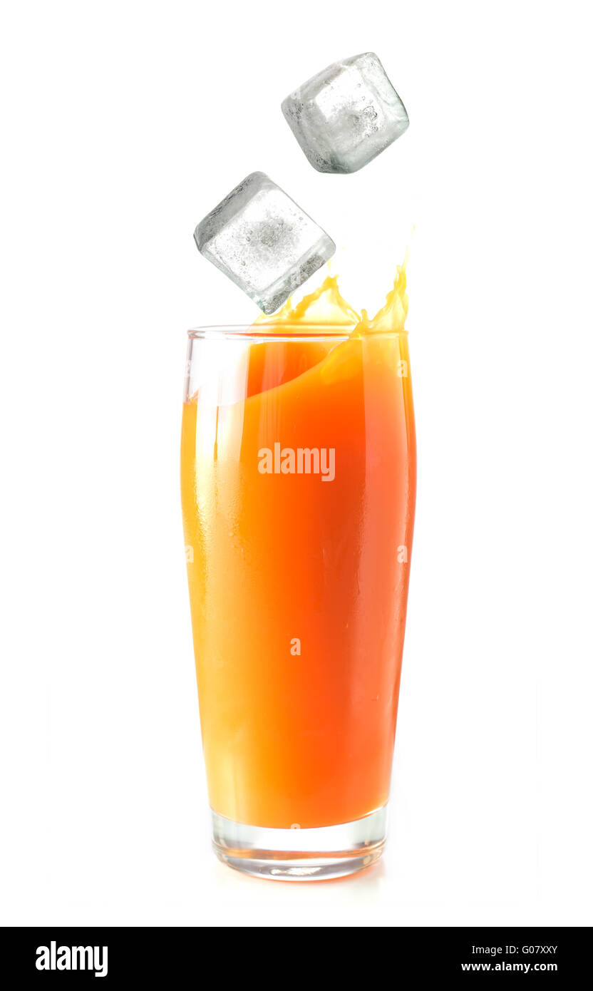 Ice cubes falling in glass of orange juice Stock Photo Alamy