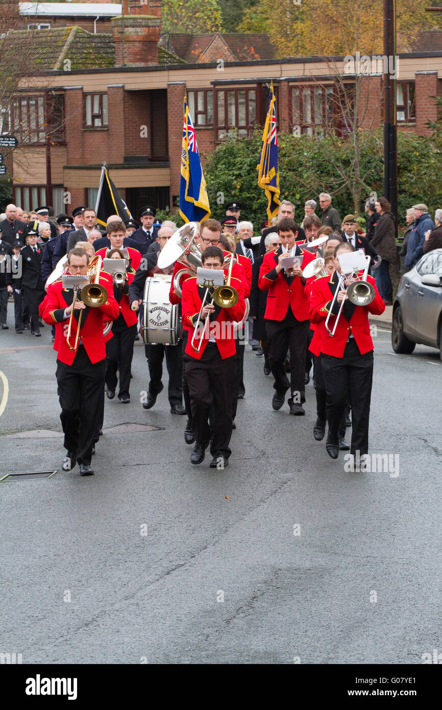 In bright red jackets the Woodbridge Excelsior brass band lead a