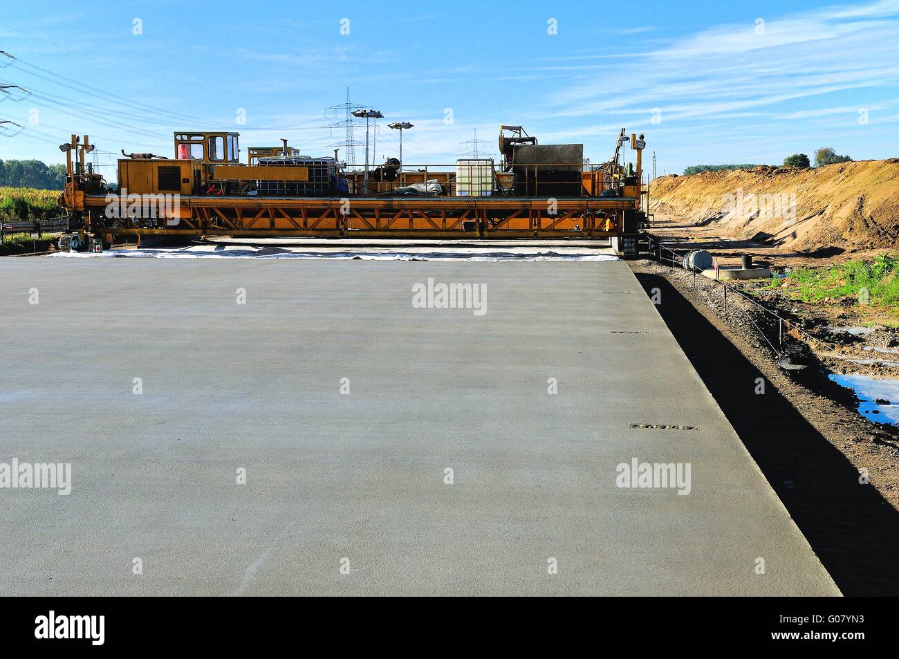 Freshly poured concrete finisher highway roadway, Stock Photo