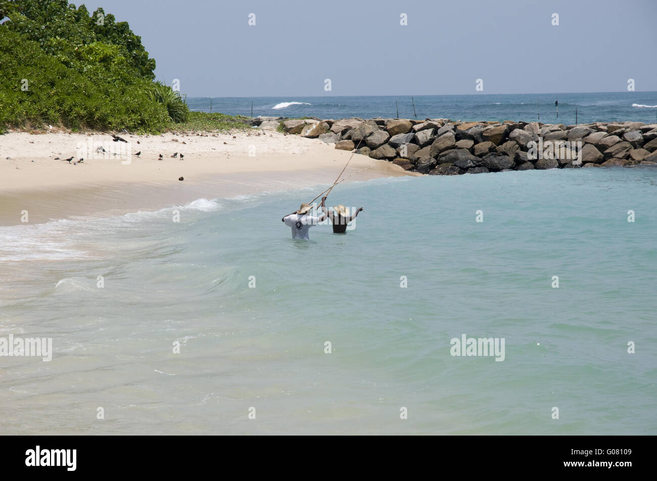 Fishermen on beautiful beach in Sri Lanka Stock Photo