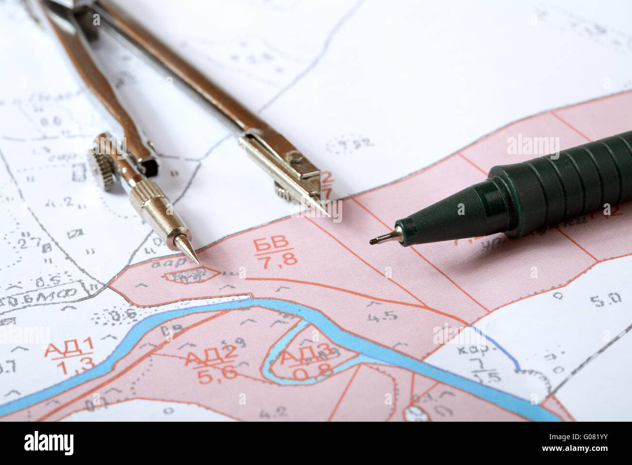 Topographic map of district with measuring instrument Stock Photo Alamy