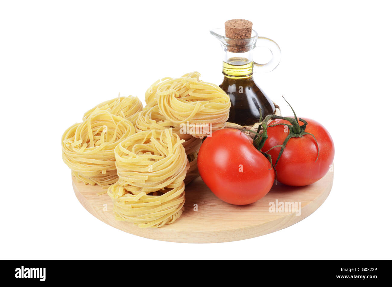 Pasta with an olive oil and tomatoes isolated Stock Photo - Alamy