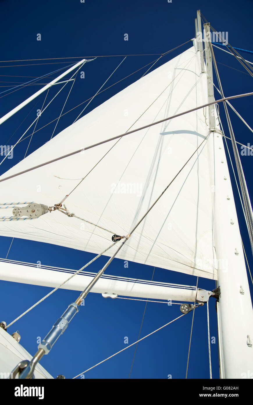 Sail of a catamaran at calm weather with blue sky Stock Photo