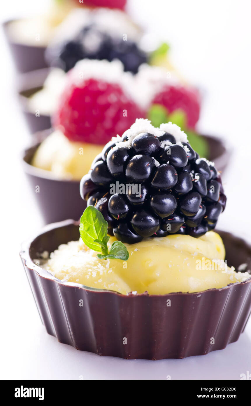 chocolate tartlets with custard and fresh berries Stock Photo