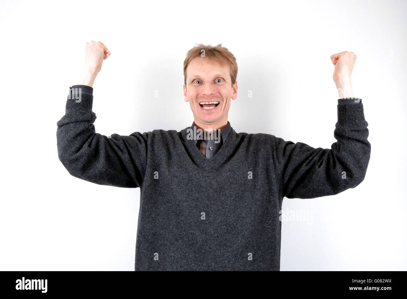 Blond man in victory Stock Photo