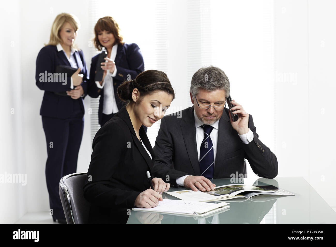 Offiiceteam at a meeting Stock Photo