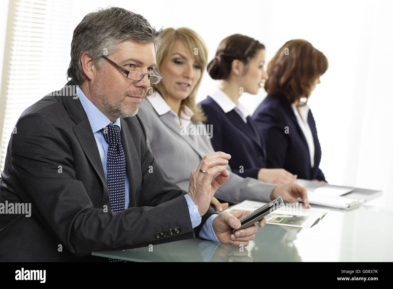 Offiiceteam at a meeting Stock Photo