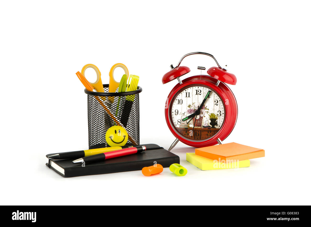 Alarm clock, folder and pen Stock Photo