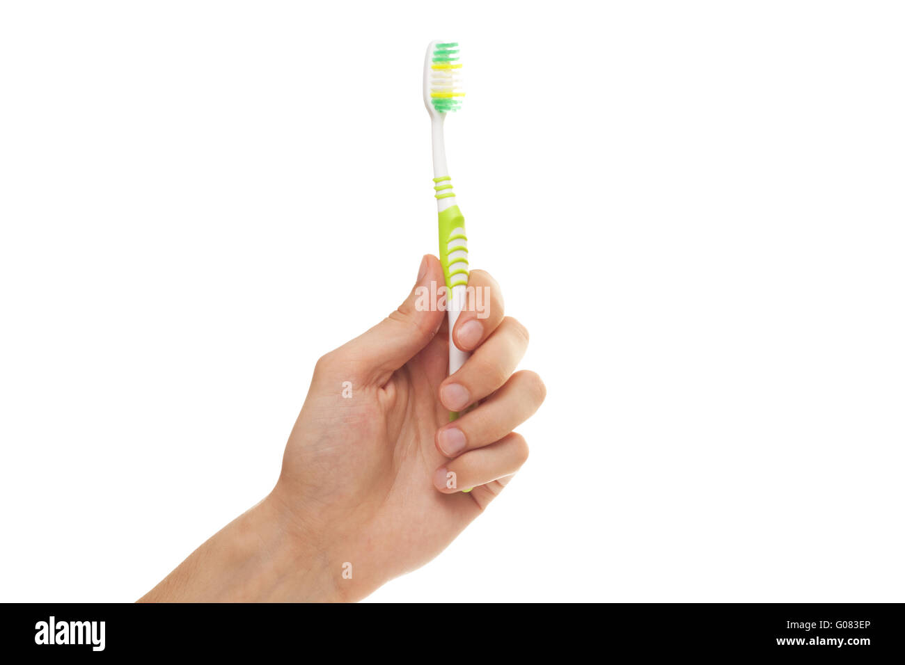 hand with green tooth brushe isolated over white b Stock Photo