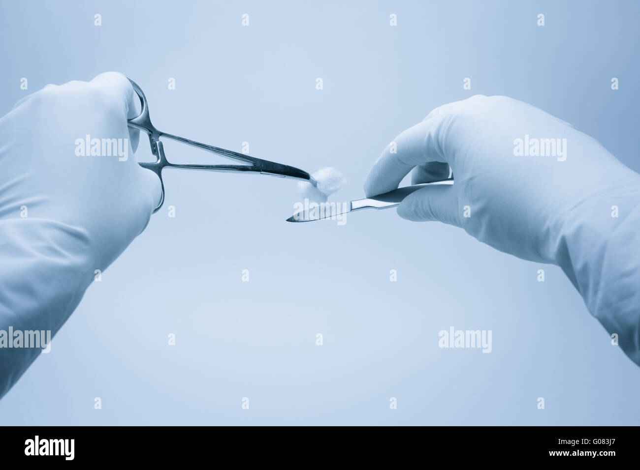 surgeon and assistent nurse hands  during surgery Stock Photo