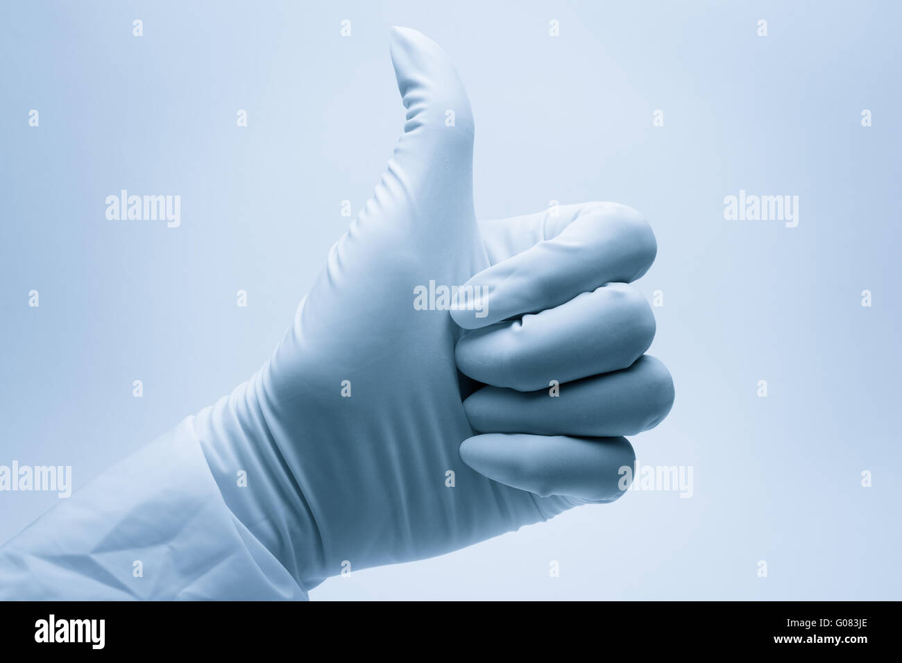 surgeon hand with thumb up after the successful su Stock Photo - Alamy