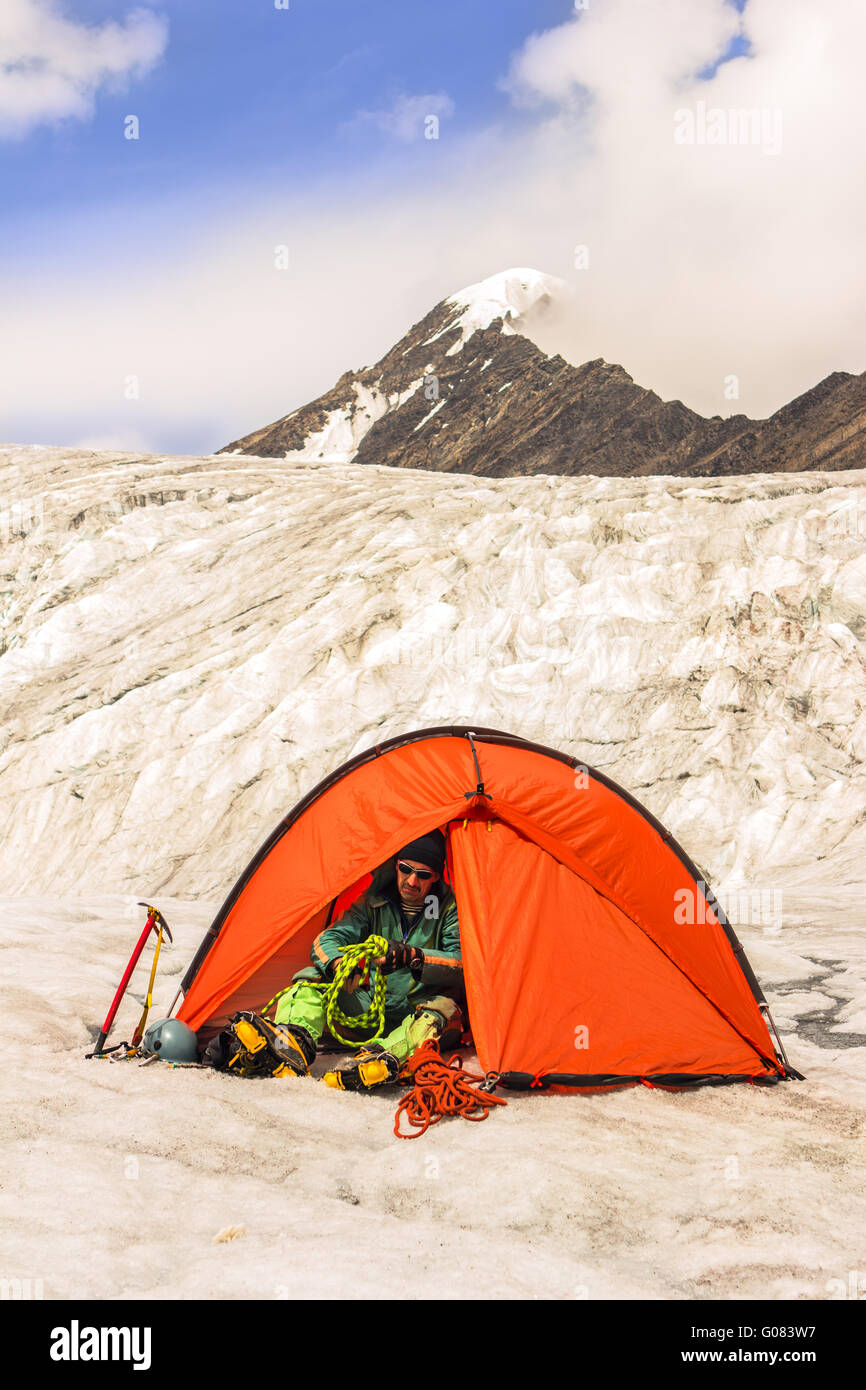 The climber prepares sports equipment at competitions Stock Photo Alamy