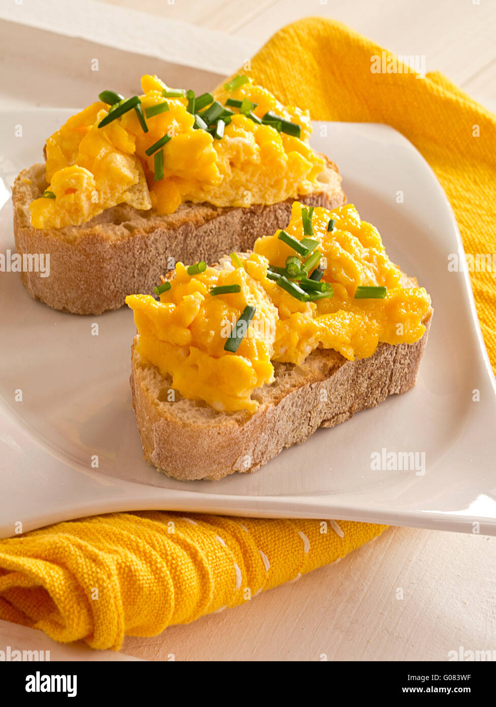 Scrambled eggs with chives garnished on a plate Ba Stock Photo - Alamy