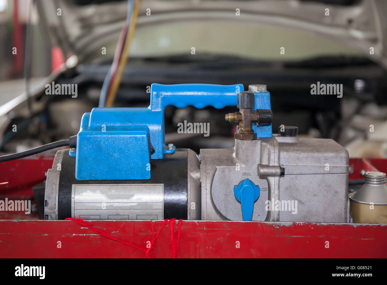 Monitoring tools for automotive air conditioning in car garage Stock Photo Alamy