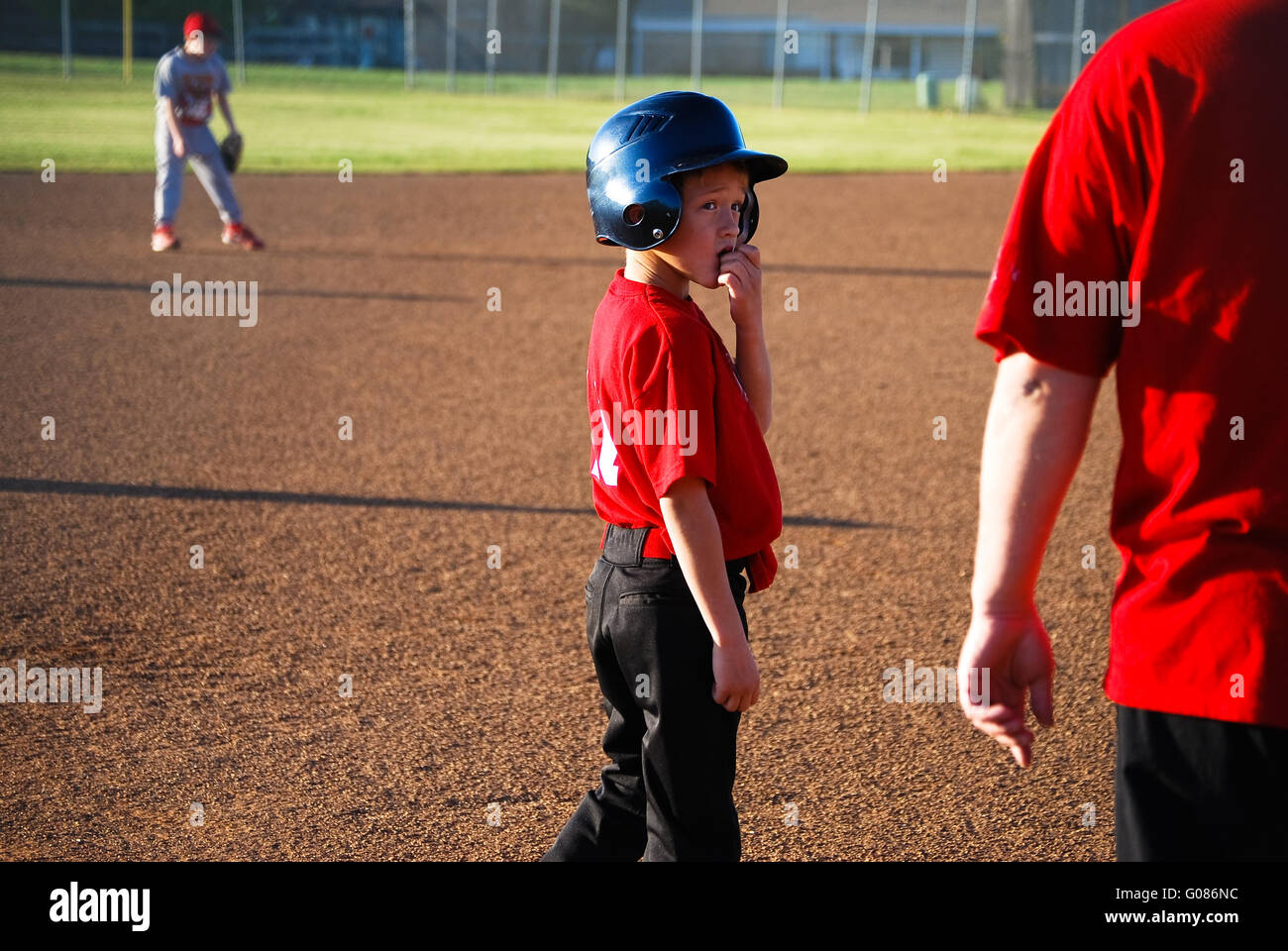 Baseball boy looking coach hi-res stock photography and images - Alamy