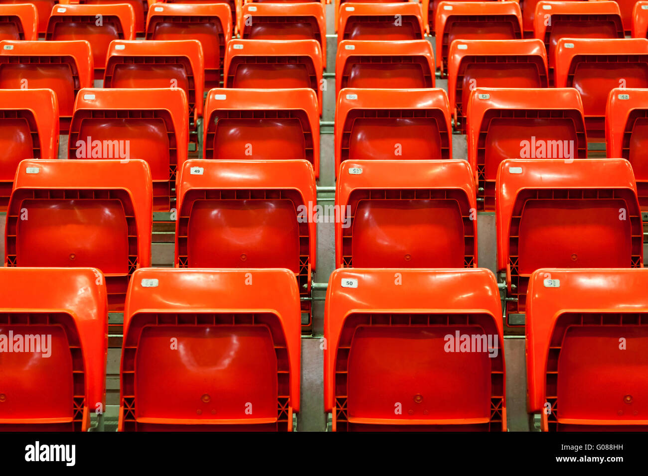 Close view of empty stadium red seats before a match Stock Photo