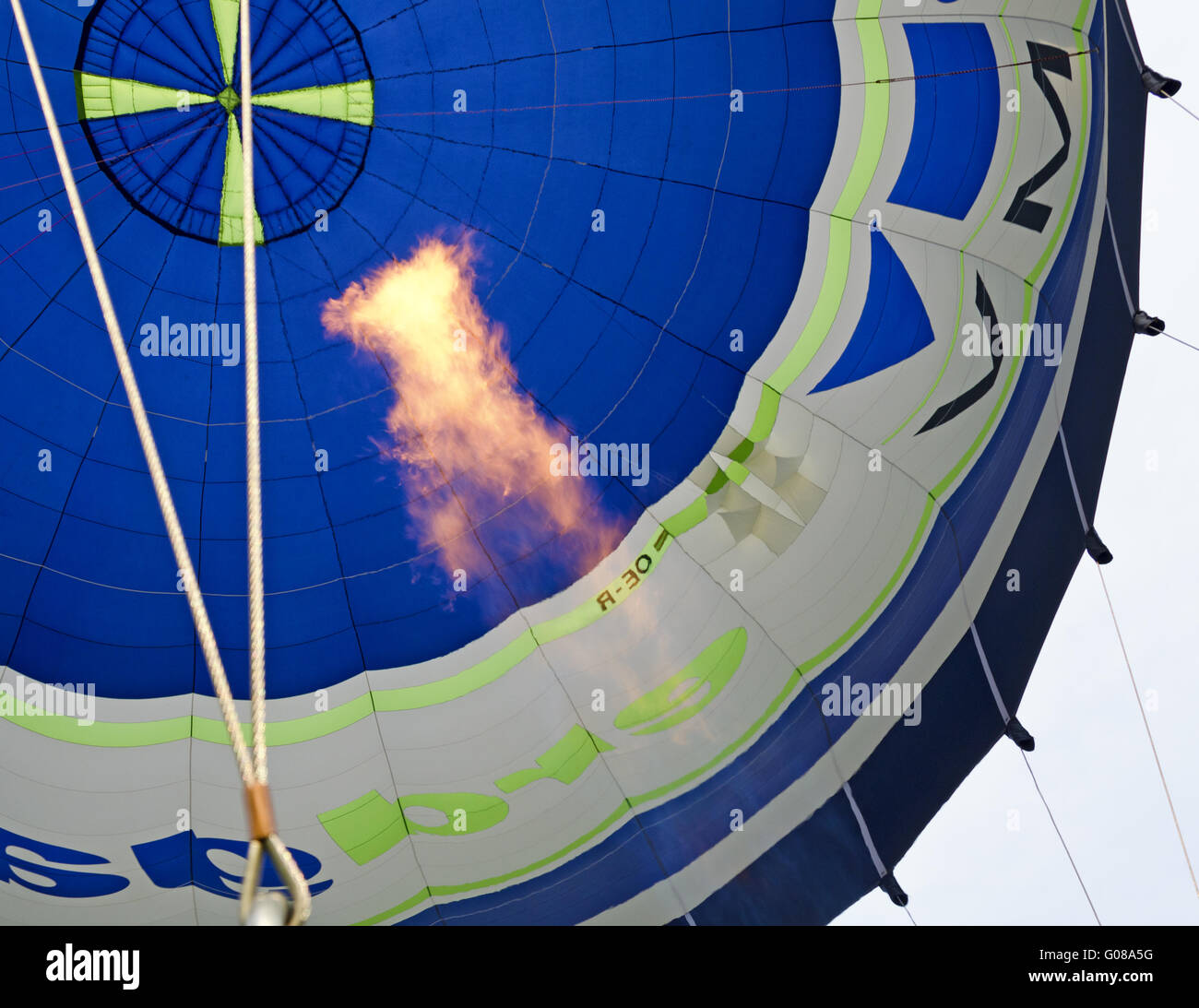 blue white hot-air balloon and big gas flame Stock Photo