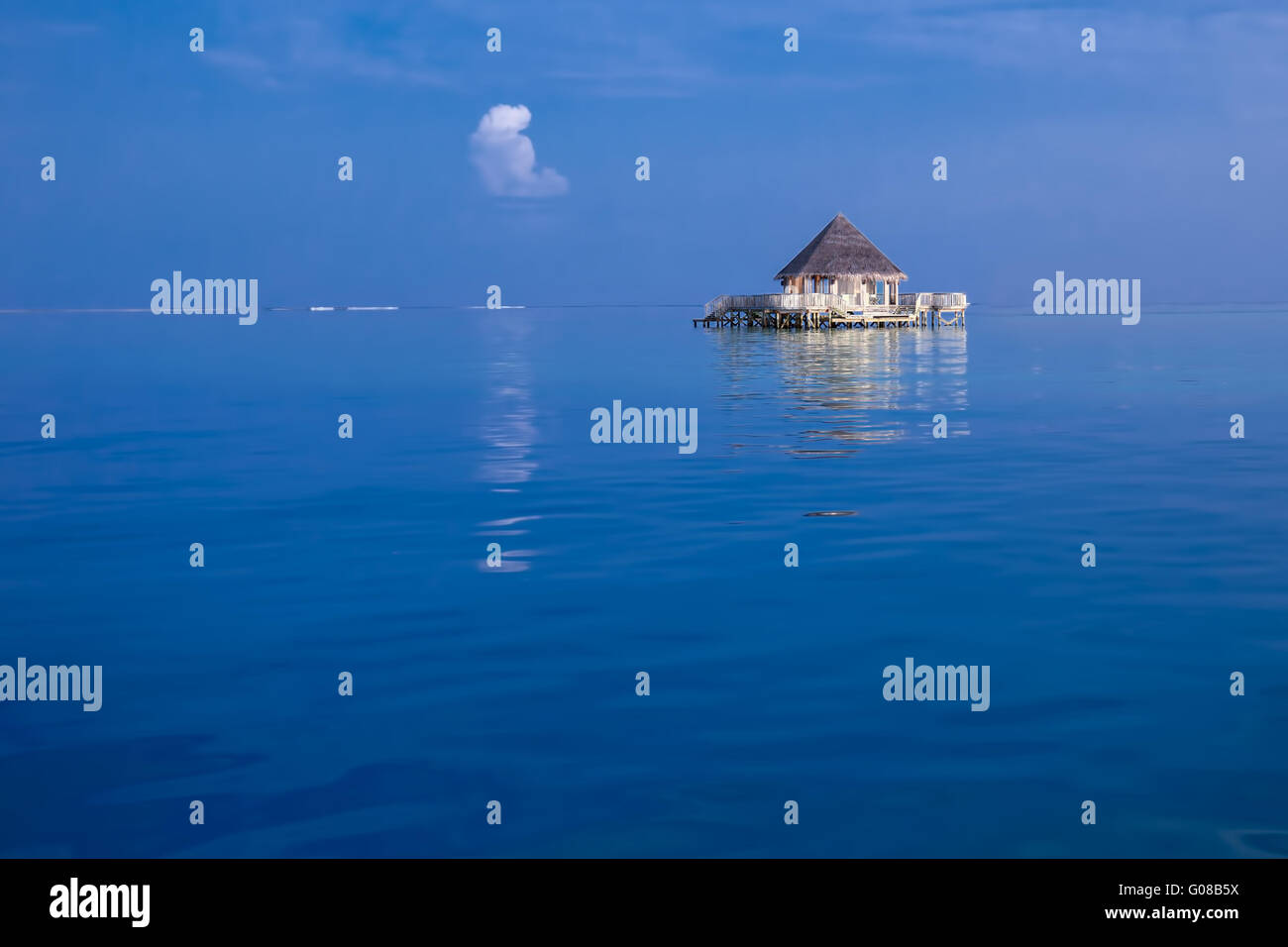 Overwater bungalows with tourquise clear water in tropical island Stock Photo
