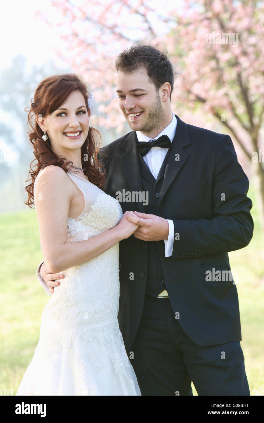 Newlyweds Hold Hands Stock Photo - Alamy