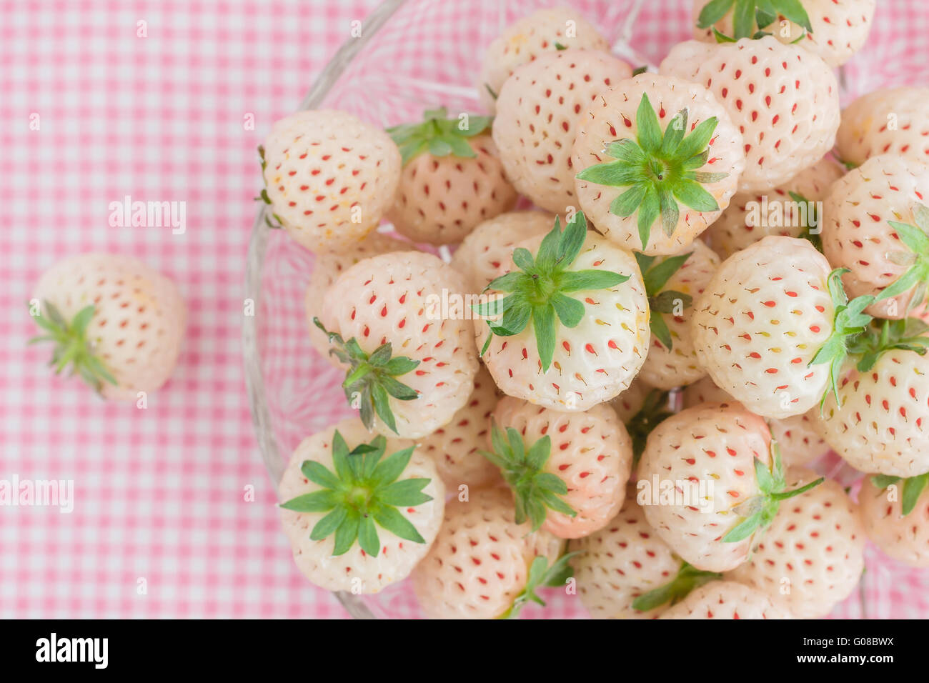 Pineberry or Hula Berry a hybrid strawberry with a pineapple flavor white flesh and red seeds Stock Photo