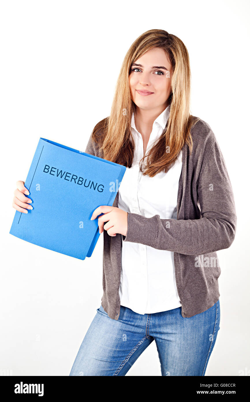 Smiling female applicant holding application folder in her hands Stock Photo